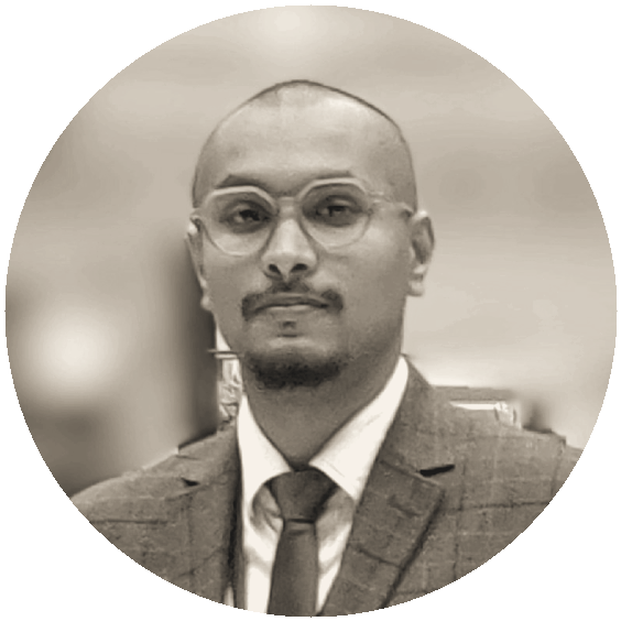 Dinesh Achari — portrait in warm ink duotone